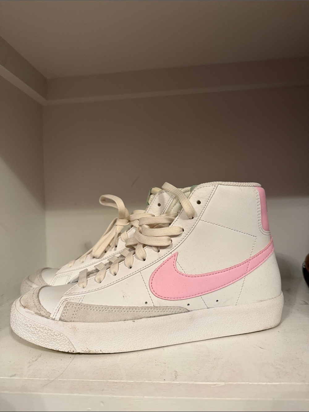 Nike Blazer Mid '77 sneakers in the Summit White and Pink Foam colorway.
